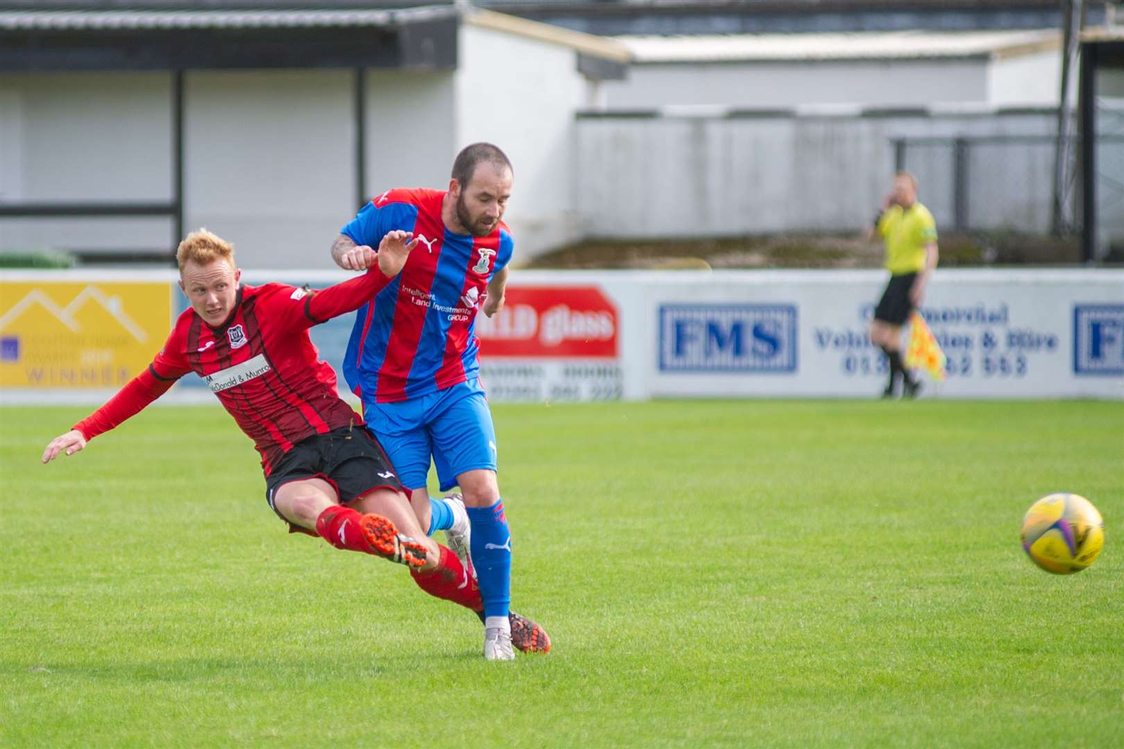 Elgin City's Russell Dingwall goes in for a challenge on Inverness' James Keatings.. Picture: Daniel Forsyth..