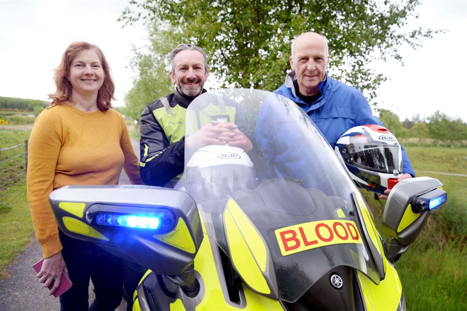 Highland and Islands Blood Bikes fundraiser Sharon Crabtree with vice chairman Graham Allan and chairman Ross Sharp.