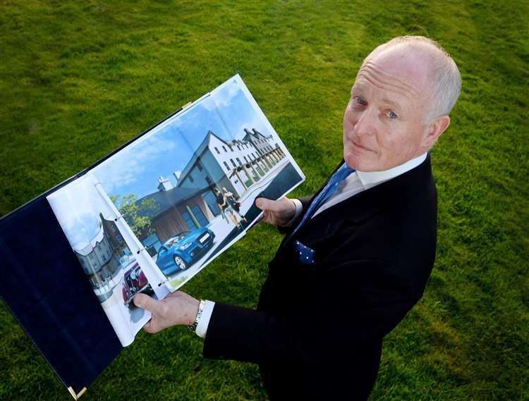 Developer William Frame with plans for his major project at Tomatin.