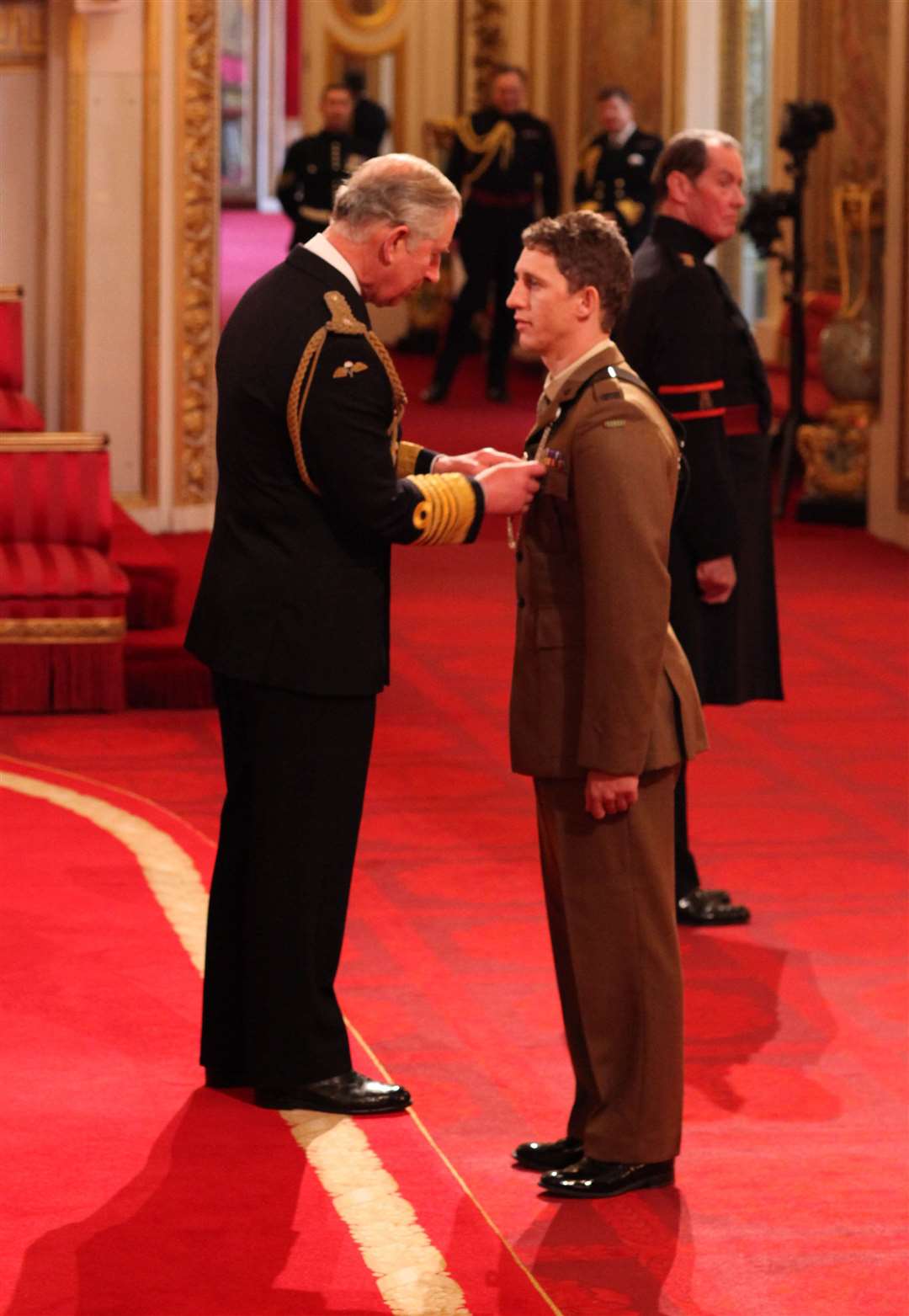 Mr Cutterham was presented with the Conspicuous Gallantry Cross by Prince Charles during an investiture ceremony at Buckingham Palace in 2012 (Lewis Whyld/PA)