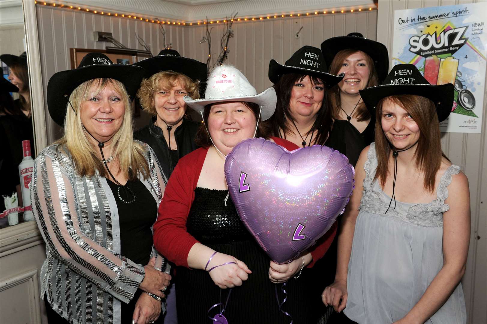 Linda Bowen (centre) enjoys her Hen Night at Gunsmiths with colleagues from Dalcross Airport.