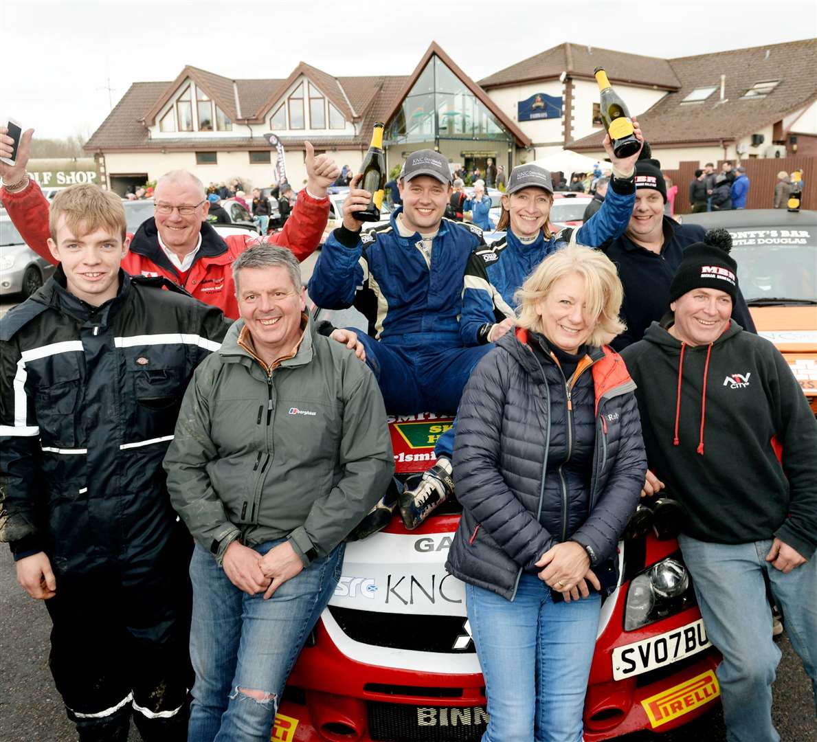 Snowman Rally 2020..Michael Binne and Clair Mole sat on the bonnet surrounded by their winning team..Picture: James MacKenzie..