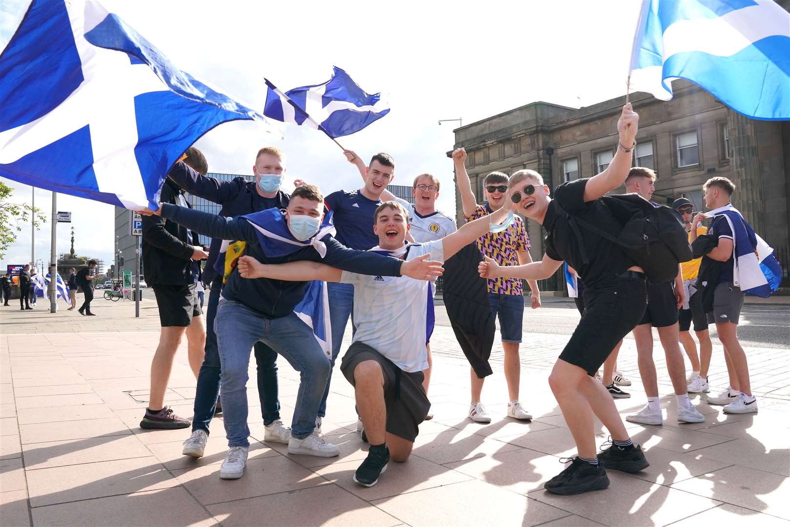 The sun came out for these Scotland supporters at the fans zone in Glasgow (Jane Barlow/PA)