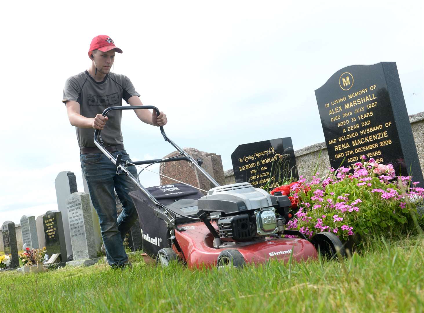 Kieran Buchan cuts the grass. Picture: Gary Anthony