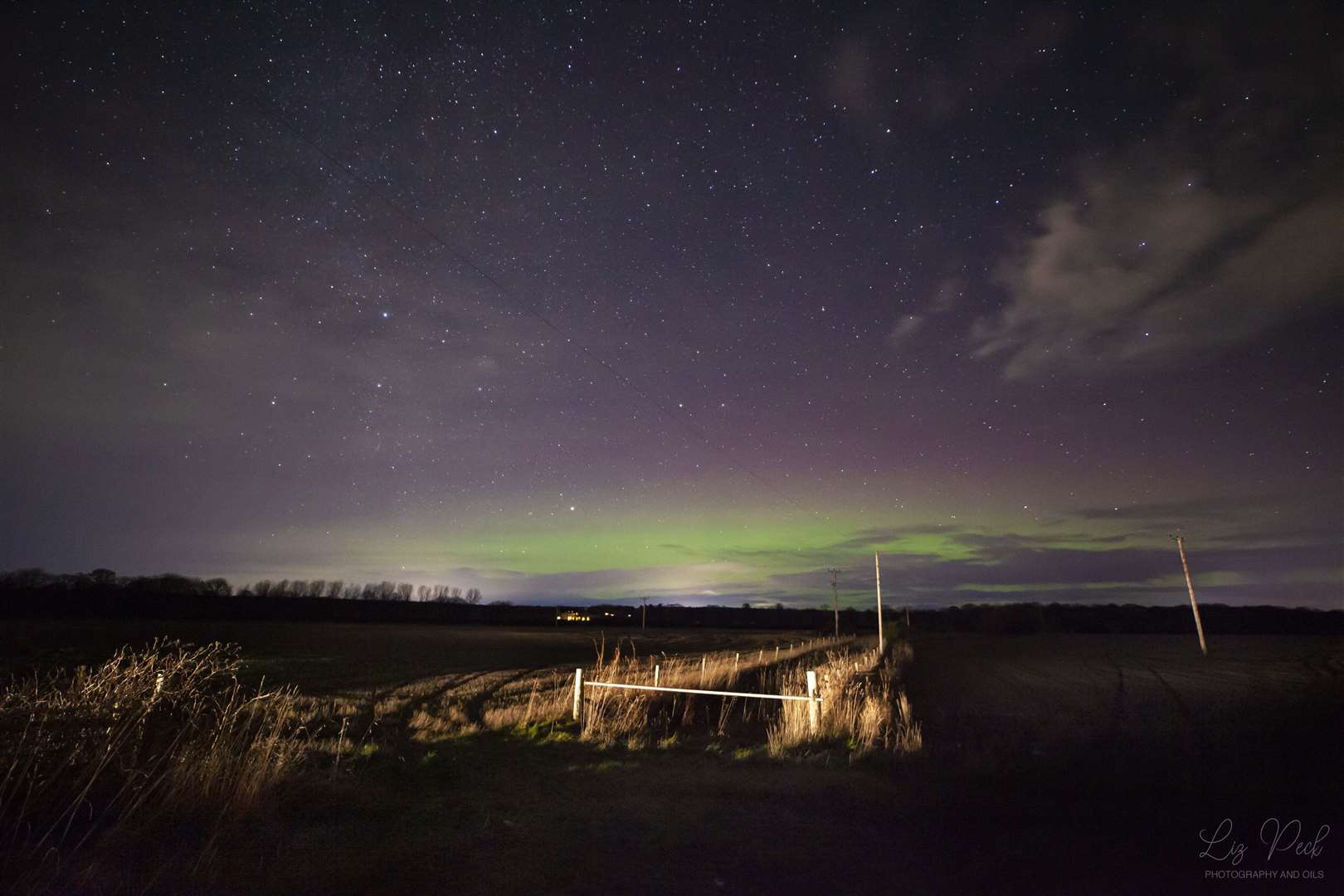 13th January. "As I arrived home from Nairn the sky cleared and the stars were blazing. My husband and I got back into the car and drove towards Cawdor, stopping in a layby just outside Clephanton. The northern sky was glowing green with a nice purple topping. Just as I pressed the shutter button a car came down the road illuminating the gate and fence of the field, providing a nice foreground". Picture by: Liz Peck photography.