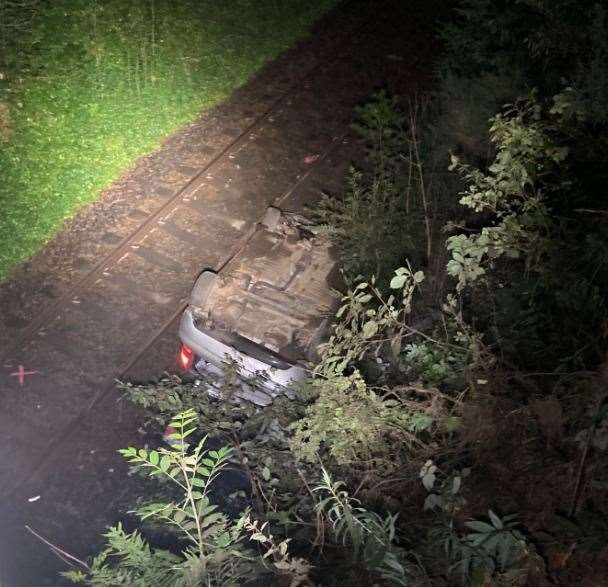 The overturned car is currently blocking the line between Huntly and Insch...Picture: Network Rail