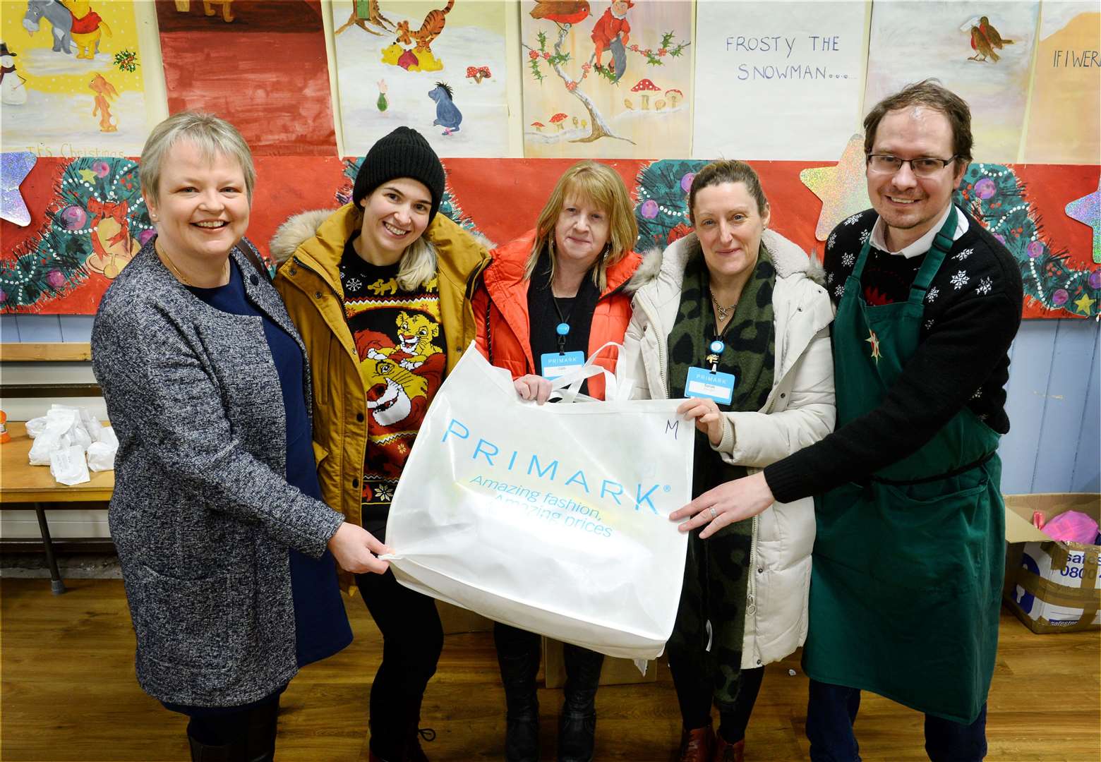 Rev Fiona Smith and Mark Lindley-Highfield with Primark staff (centre from left) Di Fraser, Cath Stewart and Sarah Bruce