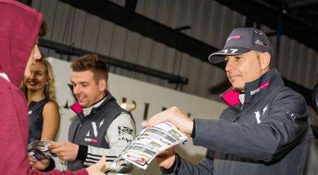 Dave Newsham signs autographs at Brands Hatch alongside team-mate Chris Smiley. Picture: Jay Adair.