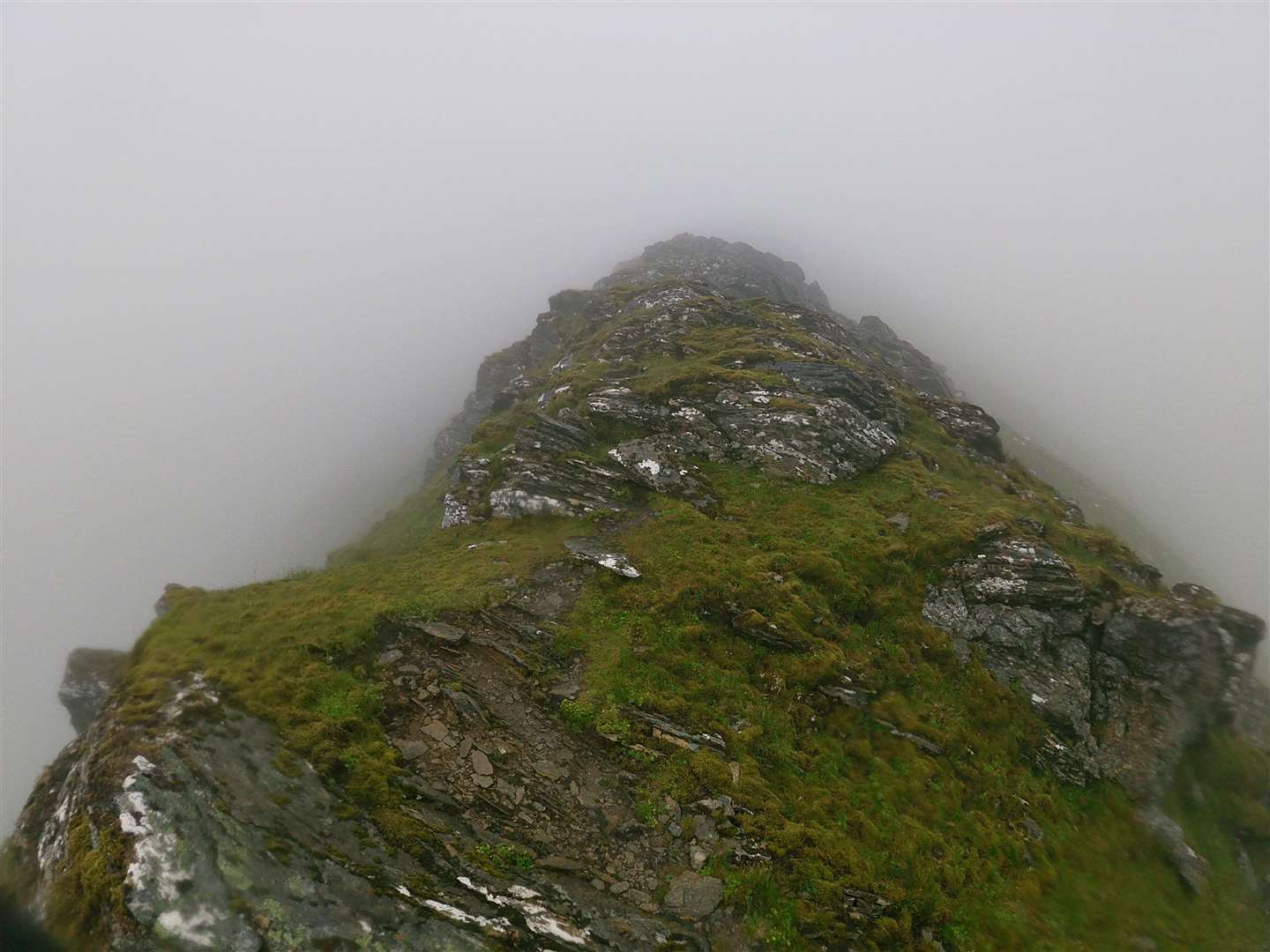 The ridge up to Sgurr a Chaorachain in the cloud.
