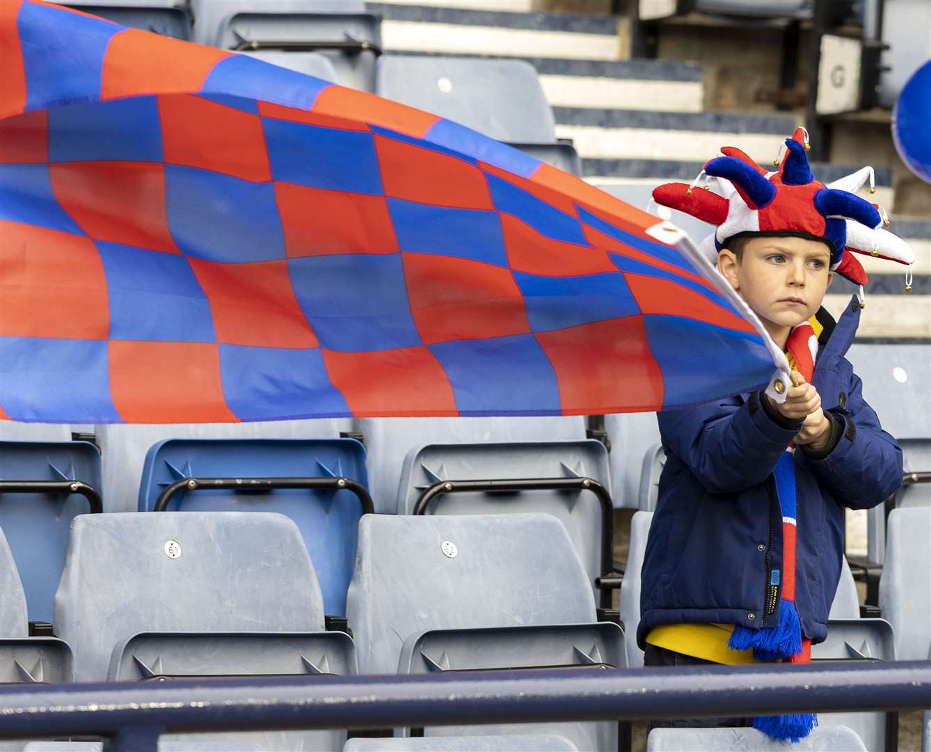 A young fan and his flag.