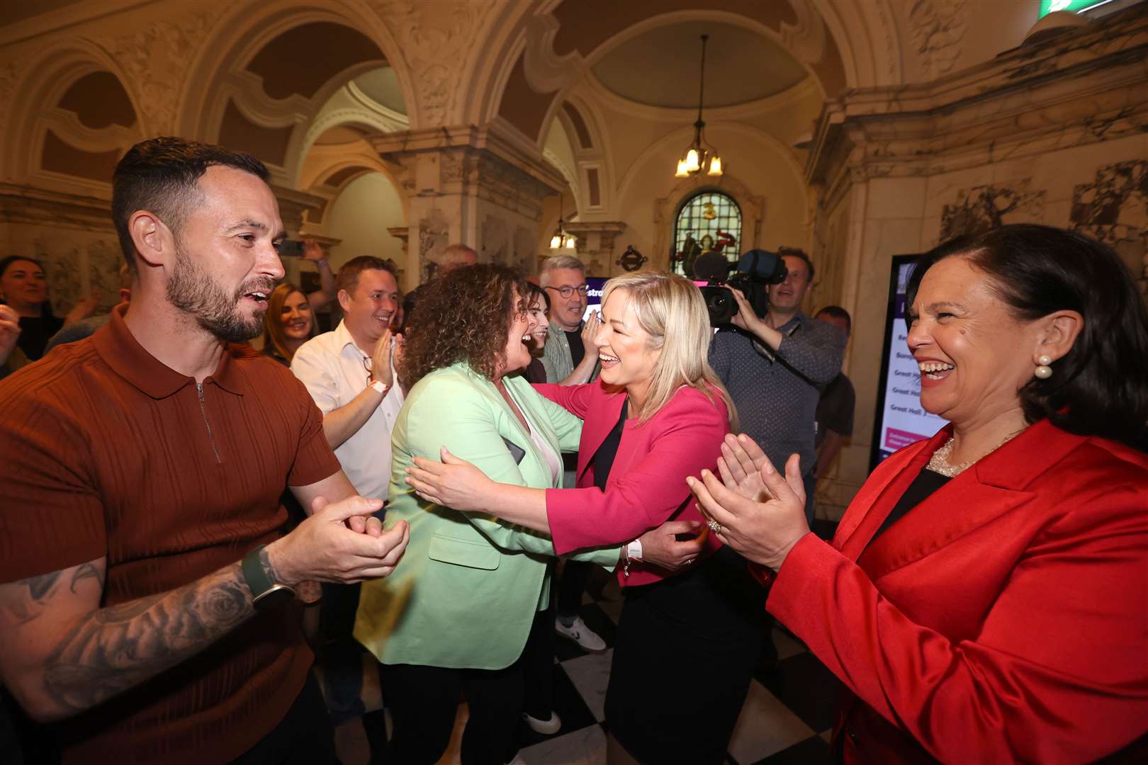 Sinn Fein president Mary Lou McDonald, right, and Sinn Fein vice president Michelle O’Neill, second right, with Bronach Anglin and Micheal Donnelly at Belfast City Hall (Liam McBurney/PA)