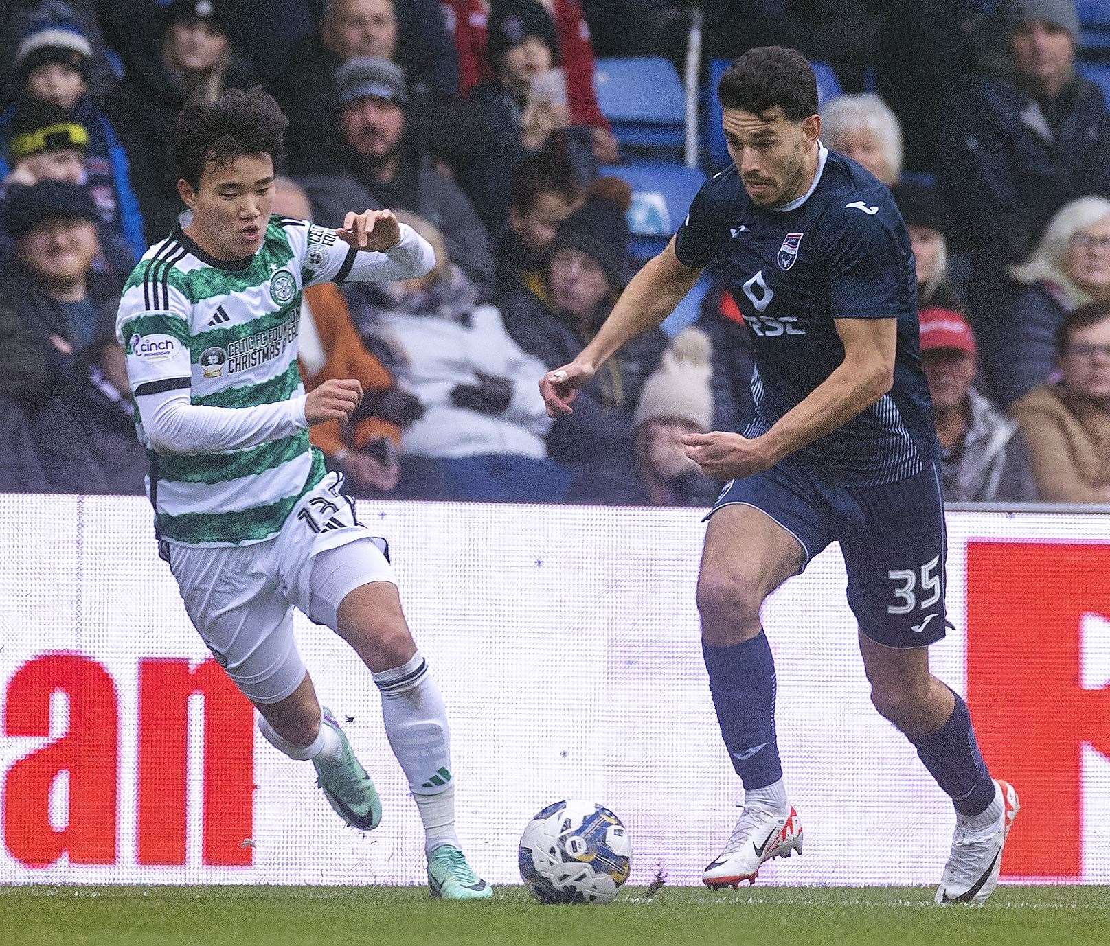 Ross County's Will Nightingale gets away from Celtic’s Yang Hyun-Jun. Picture: Ken Macpherson