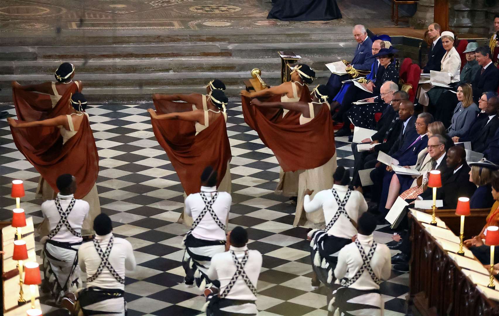 Members of the Royal family watch dancers perform, as they attend the annual Commonwealth Day Service at Westminster Abbey in London (Hannah McKay/PA)