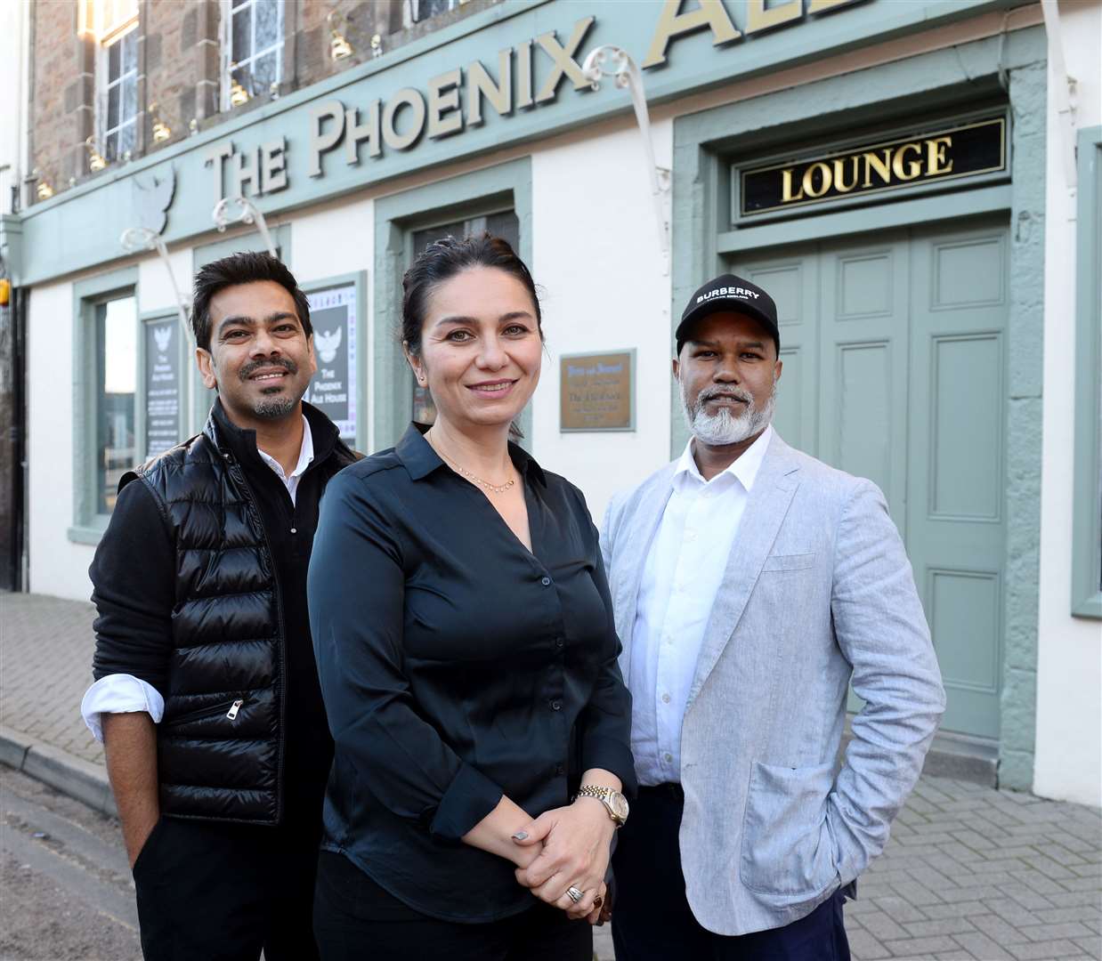 New owners of The Phoenix Ale House and restaurant Jad, right, and Funda Hussain with Abdul Fotik of Cinnamon. Picture: Gary Anthony.