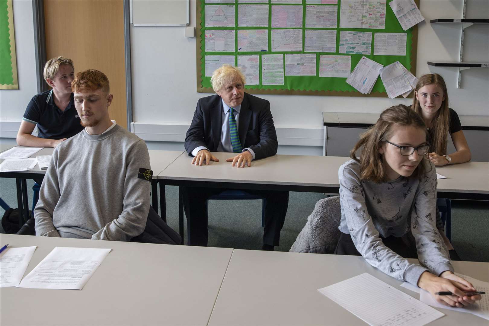 Prime Minister Boris Johnson with year 11 pupils at Castle Rock school, Coalville (Jack Hill/The Times/PA)