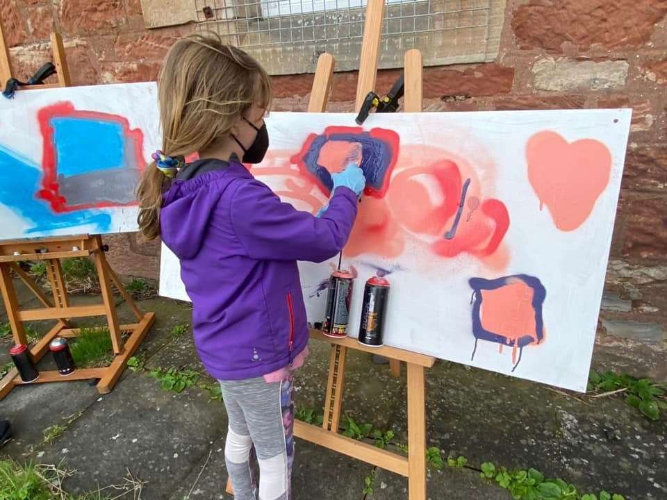Ava O'Brian at work in the graffiti session in Cromarty.