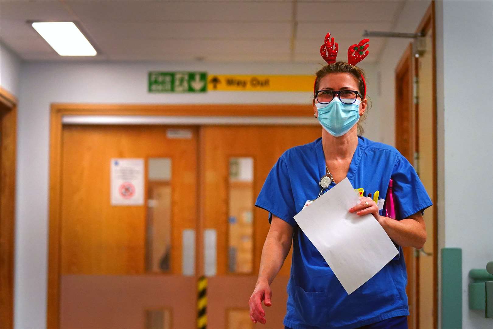 A medical staff member wearing a pair of festive antlers on the labour ward (Victoria Jones/PA)