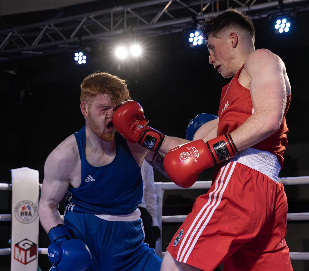 Highland Boxing Academy's Johua Morrison landing a clean uppercut against opponent Joseph Galloway before his unanimous decision victory at the club's home show. Picture: David Rothnie