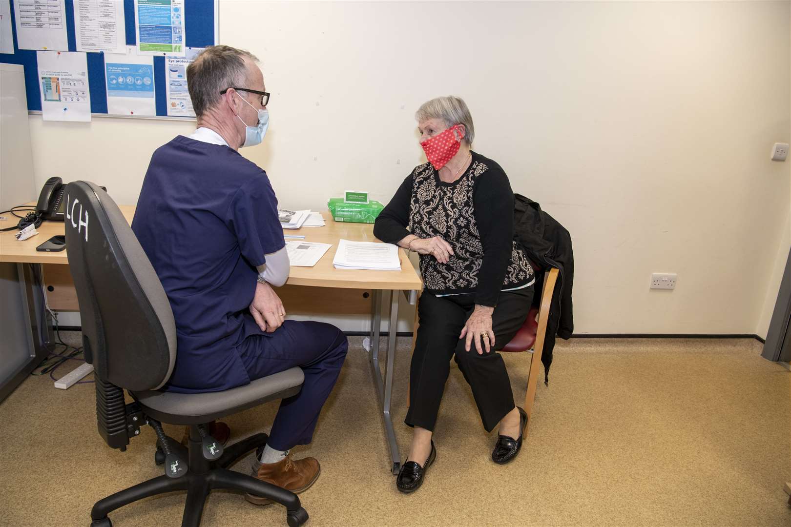 Sheila Dixon answers some brief questions from Dr Andrew Robinson before recieving the Covid-19 vaccine at Gibson Lane Practice in Kippax. Picture Tony Johnson