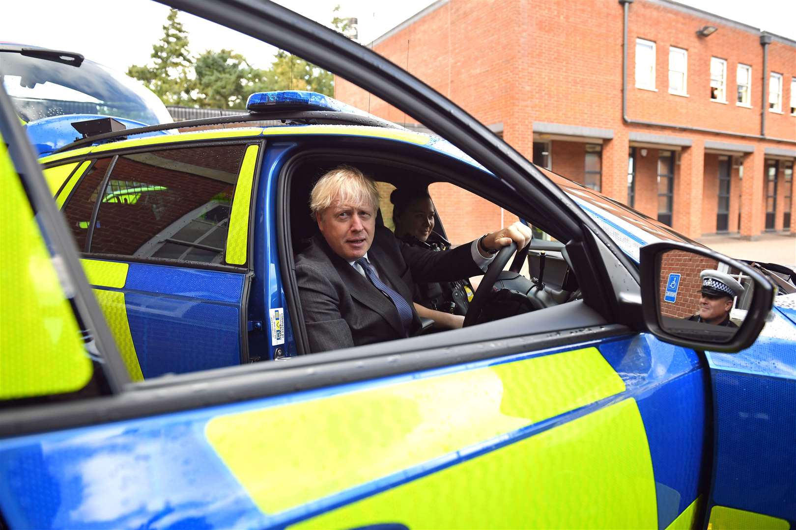 Prime Minister Boris Johnson sitting in the driver’s seat of a police vehicle during a visit to Northamptonshire Police headquarters in Northampton (Stefan Rousseau/PA)