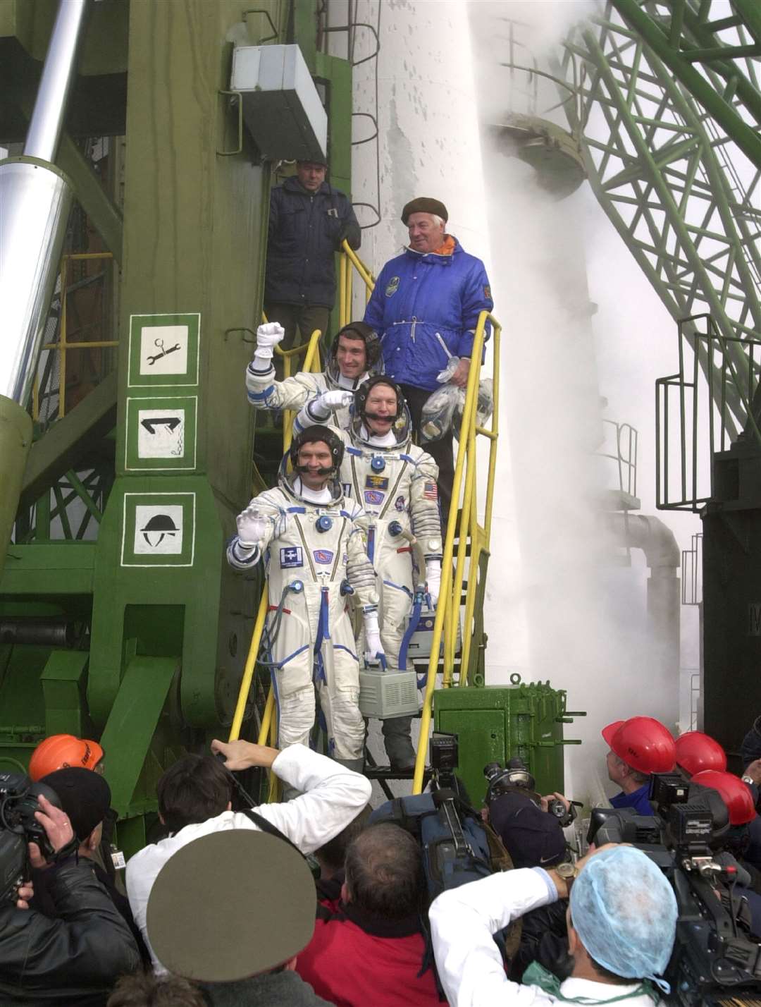 Expedition 1 crew William Shepherd, centre, Yuri Gidzenko, bottom, and Sergei Krikalev posing for photos prior to their launch (Nasa)