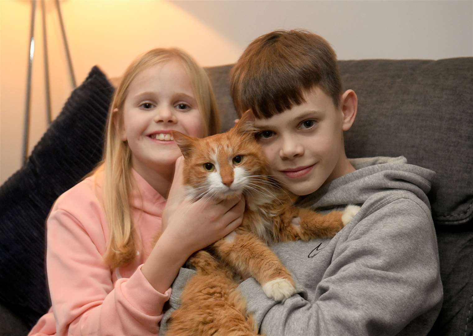 Emma and Ewan Low with Ginger, back home at last. Picture: James Mackenzie