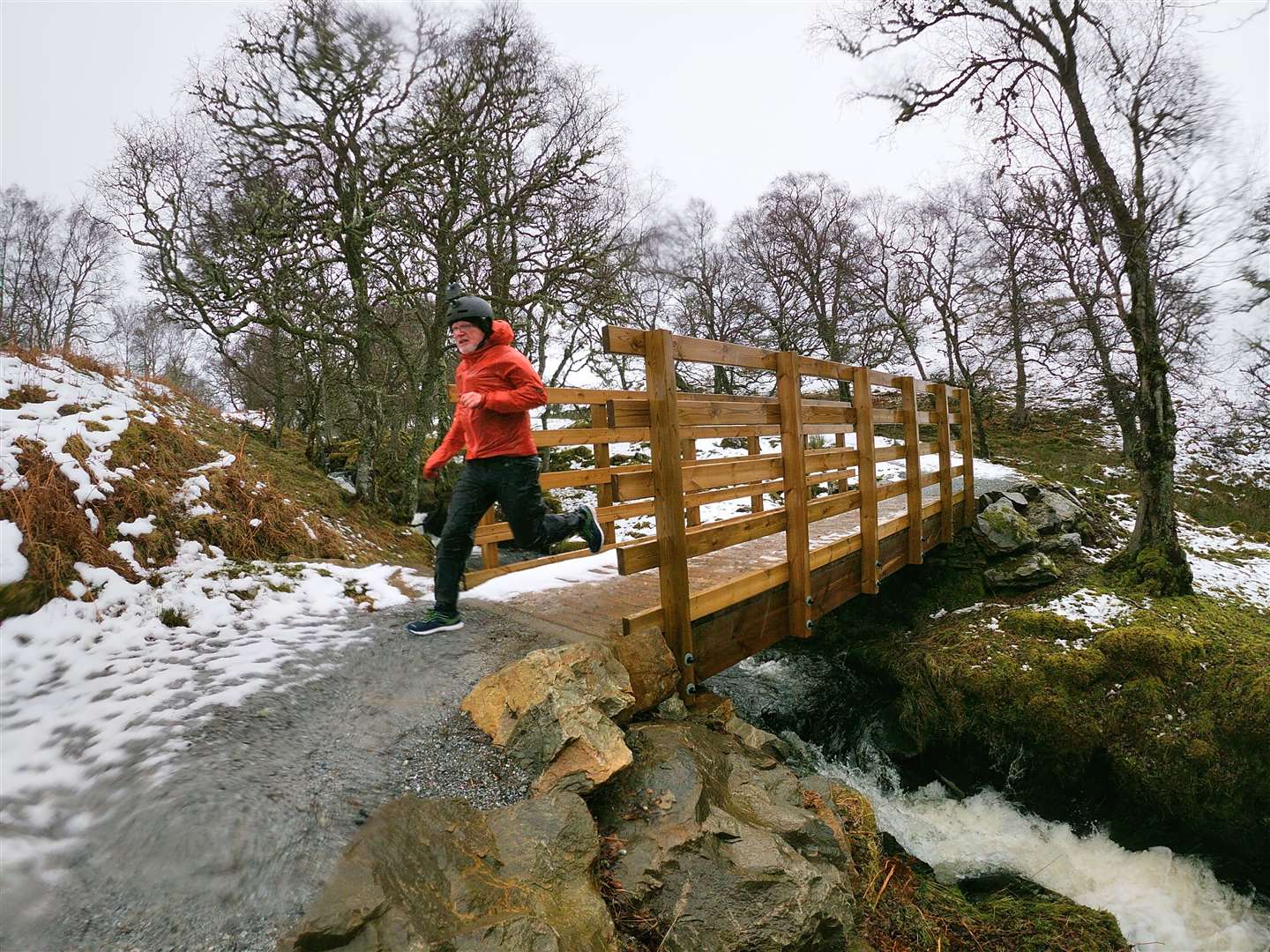 Crossing a bridge on the way down the South Loch Ness Trail towards Fort Augustus - runner is Graeme Ambrose.