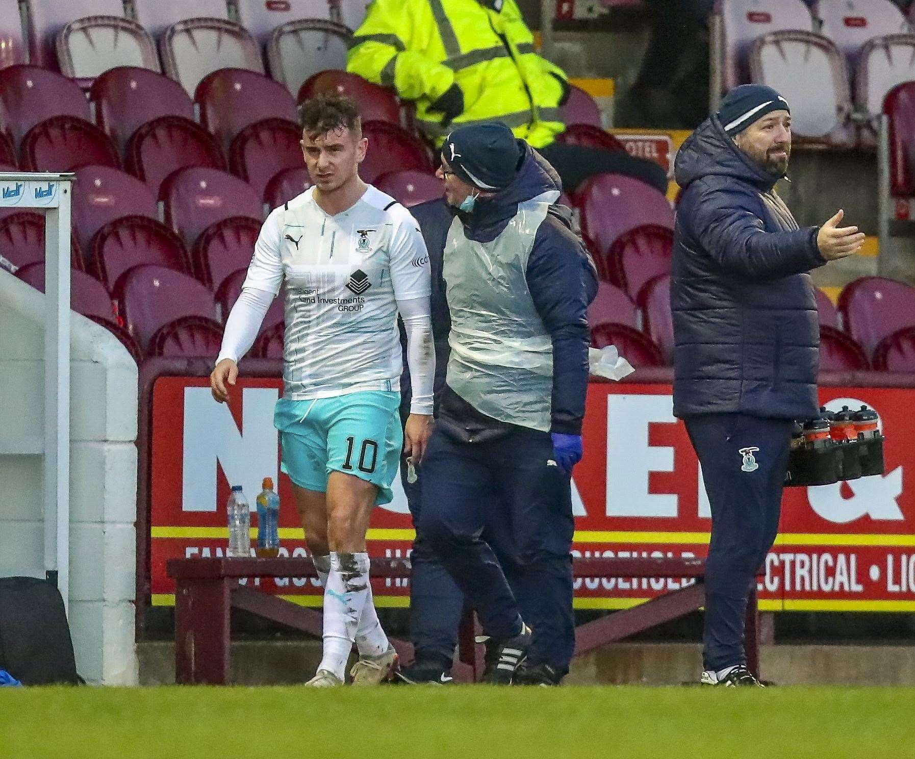 Picture - Graham Black. Arbroath(0) v Inverness CT(0). 02.01.22. ICT’s Aaron Doran goes off with physio Dougie Sim after being forced off with injury.