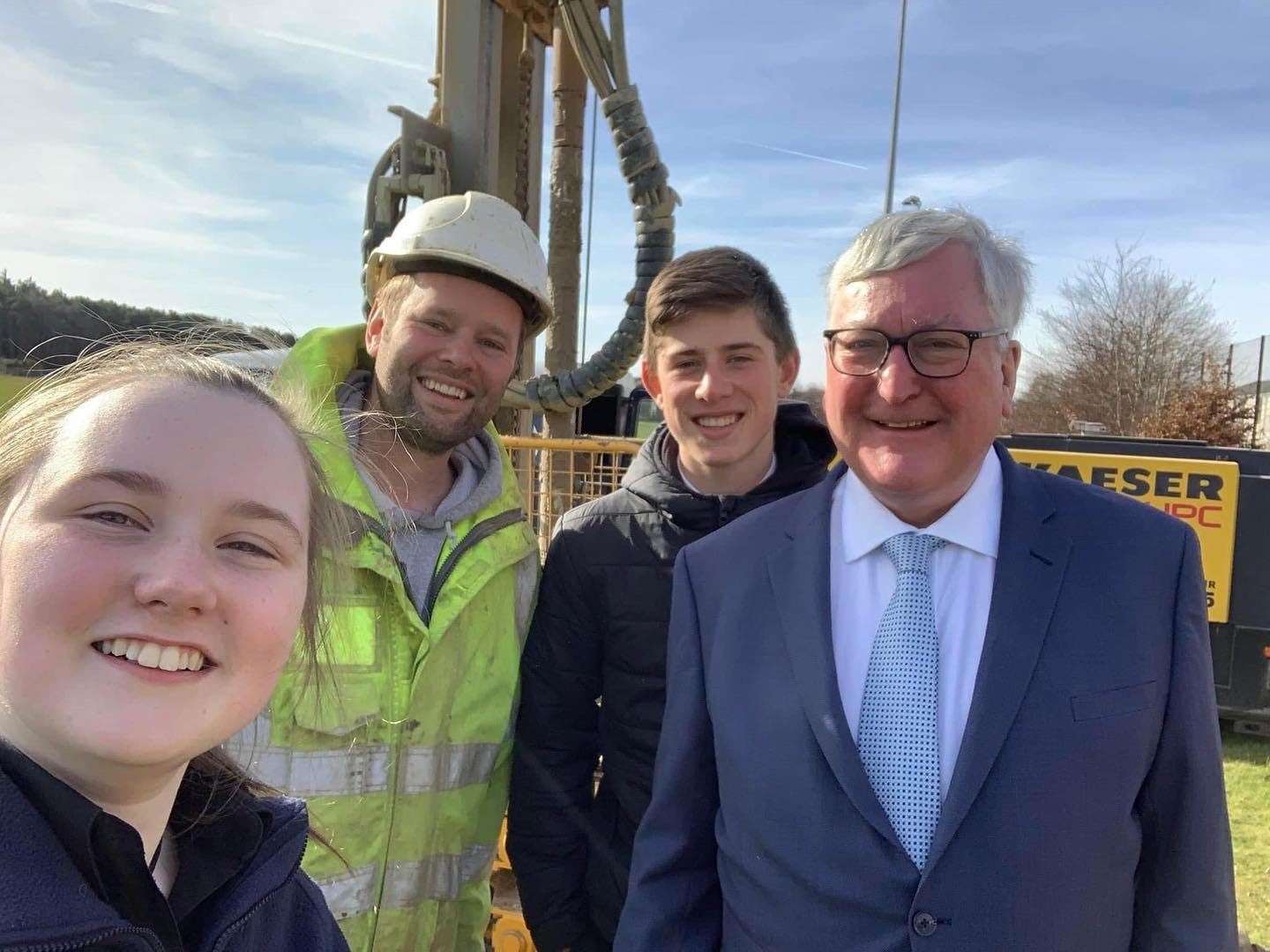 Fergus Ewing (right) with S5 pupils Alastair McNeill and Chloe McEwan and a member of Balfour Beatty staff.