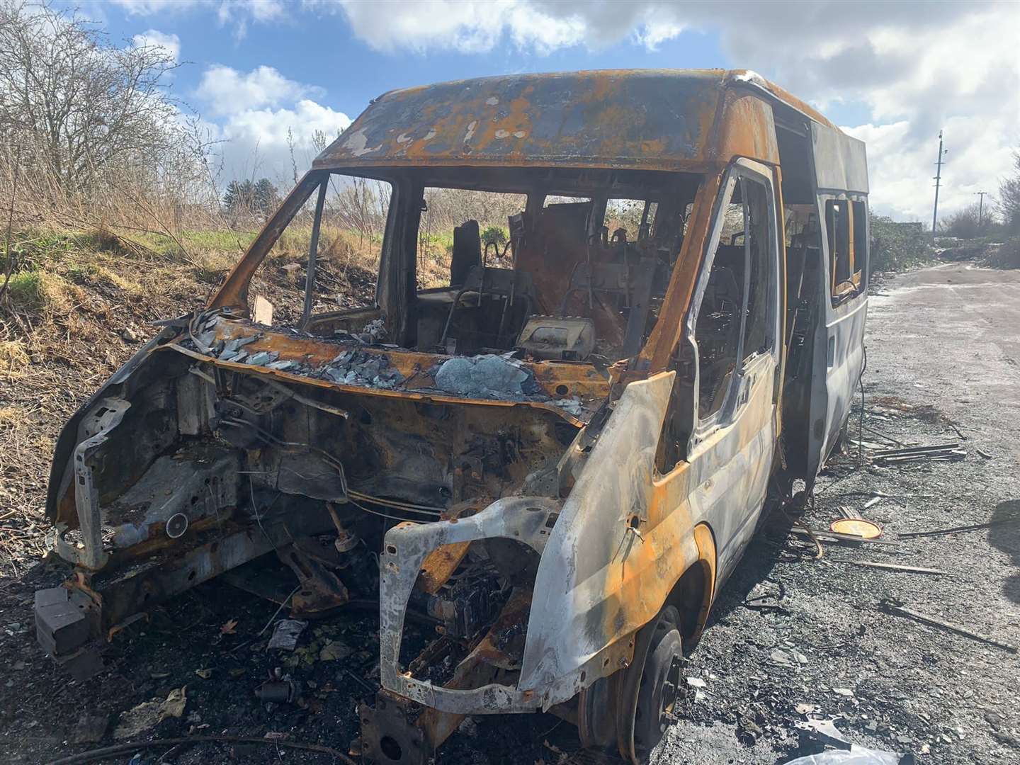 The burned-out minibus (Ben Doyle/PA)