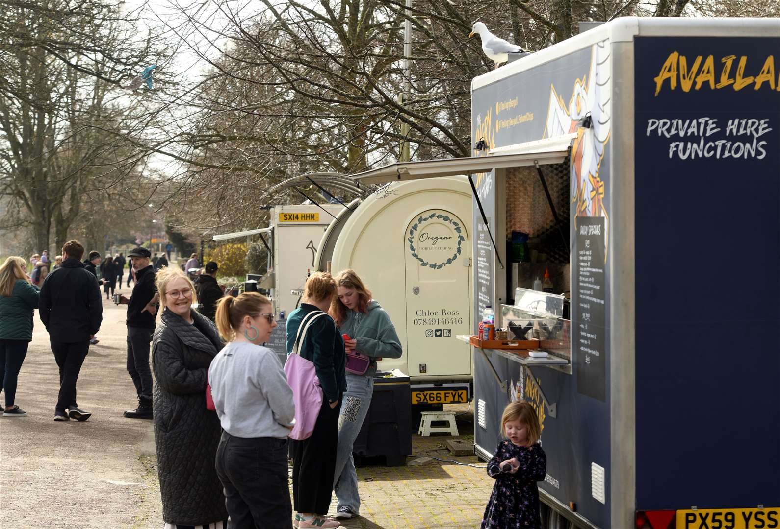 Customers stroll along the street food zone by the River Ness.