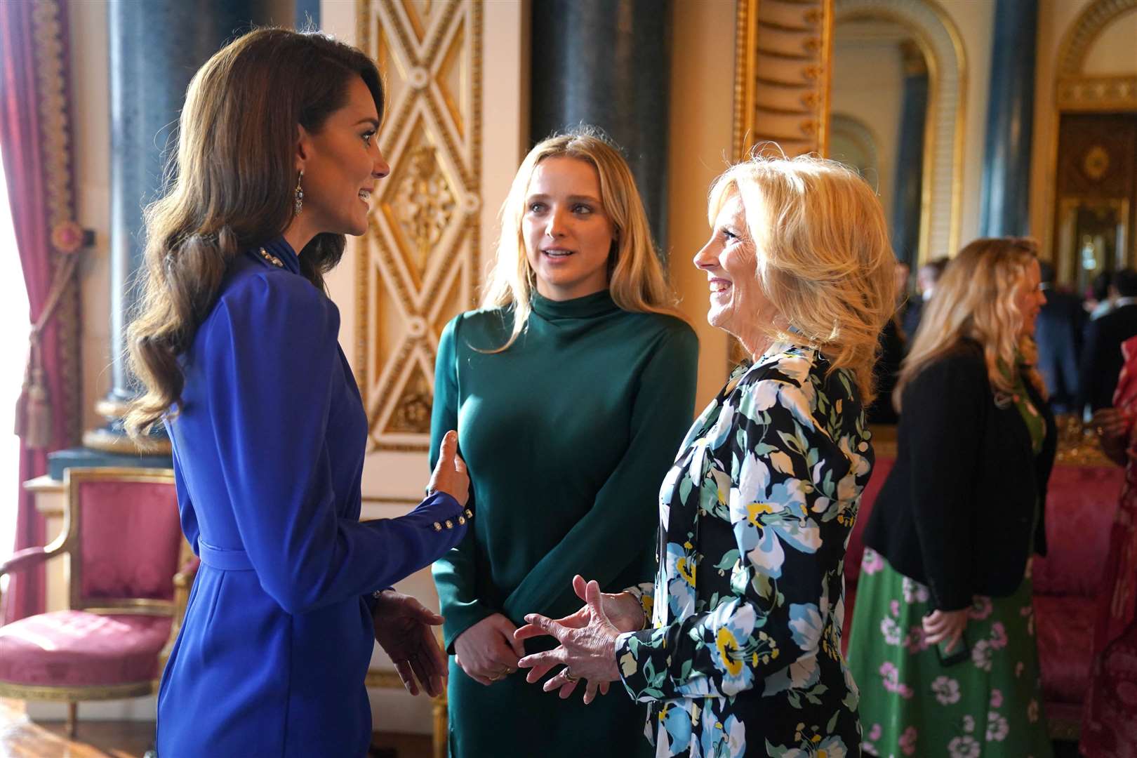 The Princess of Wales speaks (left) to the First Lady of the United States, Dr Jill Biden and her granddaughter Finnegan Biden, during a reception at Buckingham Palace on the eve of coronation (Jacob King/PA)