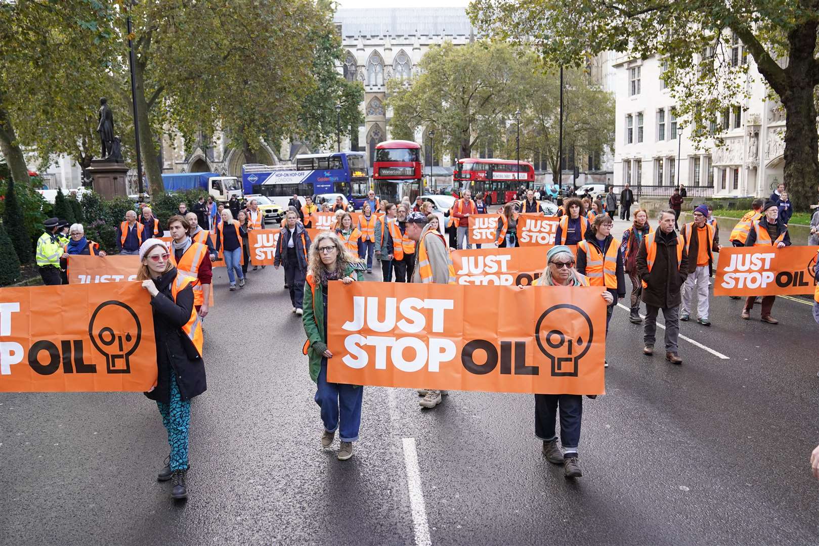 Just Stop Oil activists demonstrate in Parliament Square to demand the government immediately halt all new oil, gas and coal projects in the UK (Stefan Rousseau/PA)