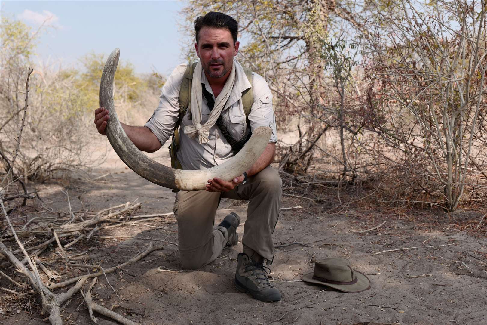 Levison Wood with an elephant tusk in Botswana. Picture: PA Photo/Simon Buxton
