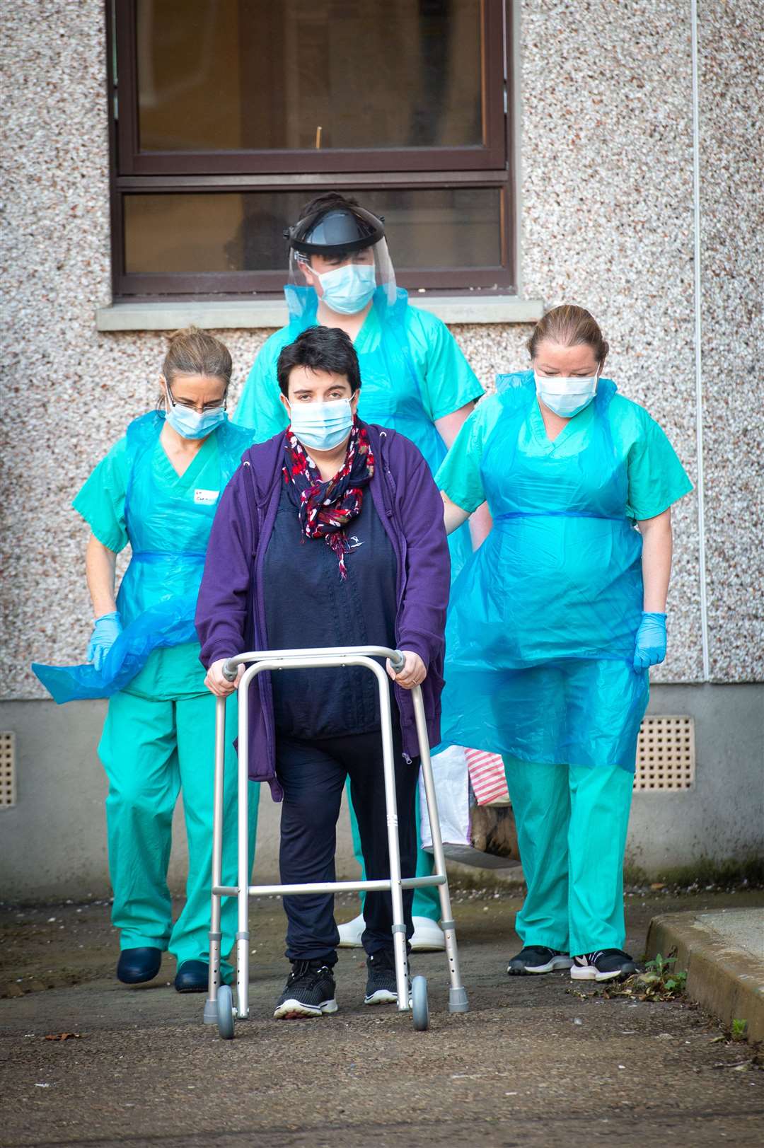 Sarah MacDougall leaving Raigmore Hospital with some of the medics who helped look after her....Picture: Callum Mackay..