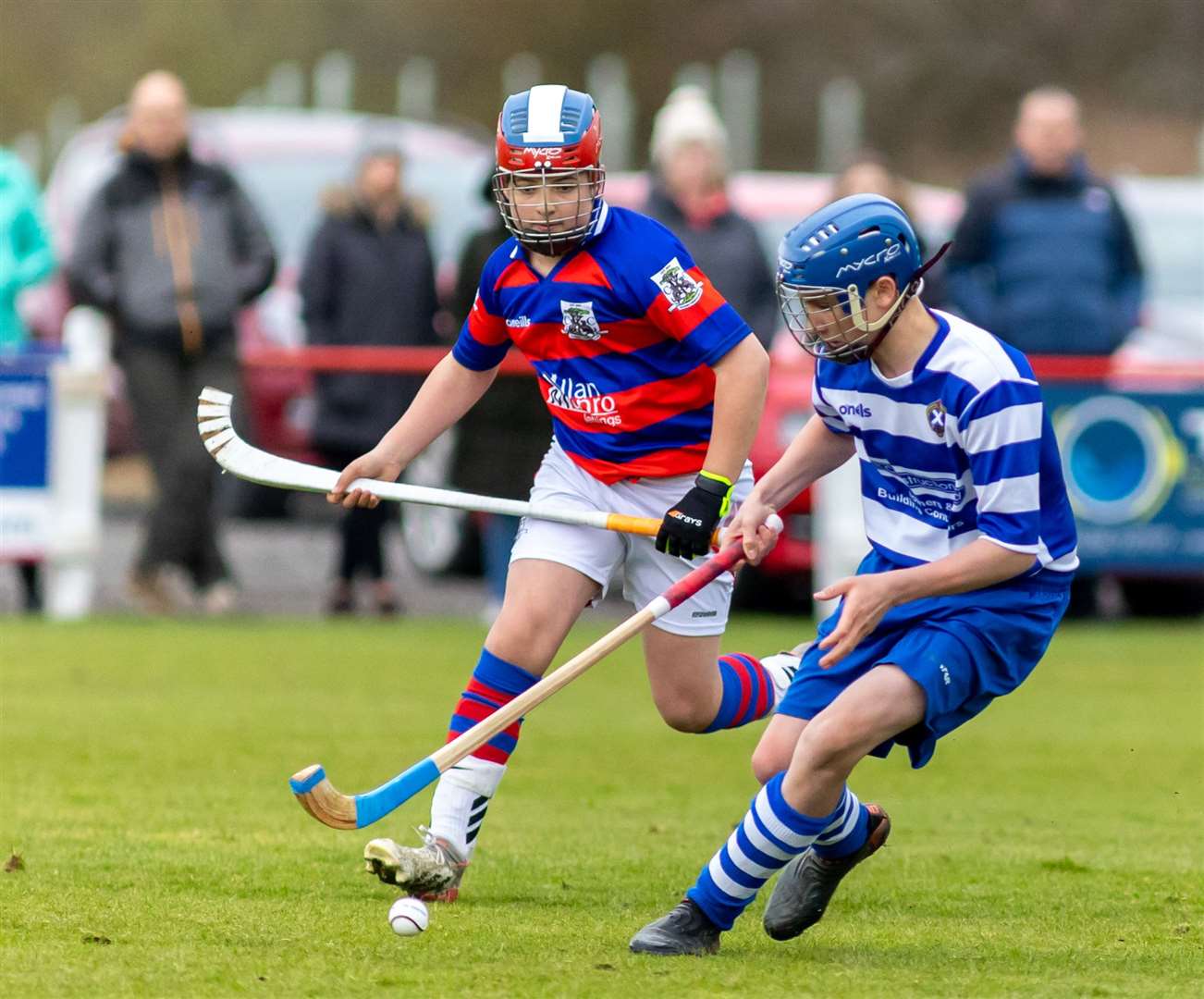 Young shinty players in action.