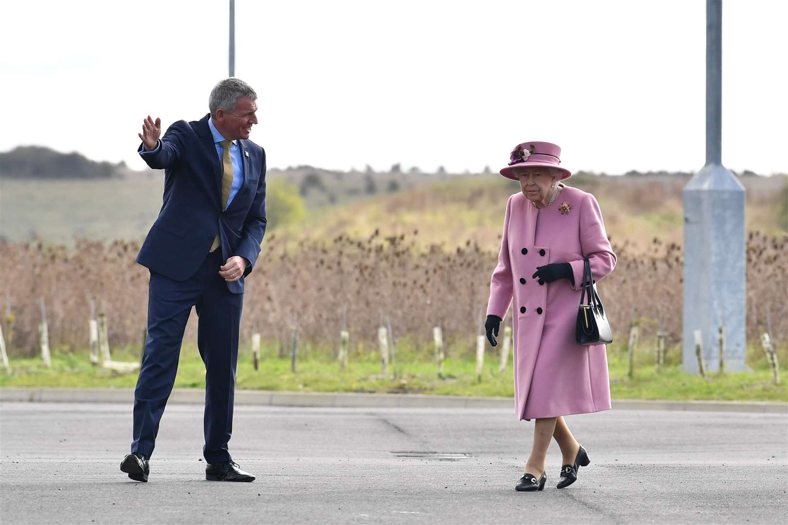 A socially distanced greeting for the Queen from Dstl chief executive Gary Aitkenhead at Porton Down (Ben Stansall/PA)