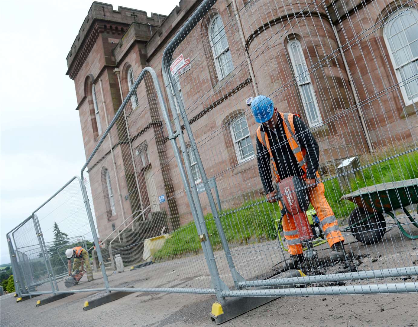 Workers drill holes for hoarding at Inverness Castle. Picture: Gary Anthony