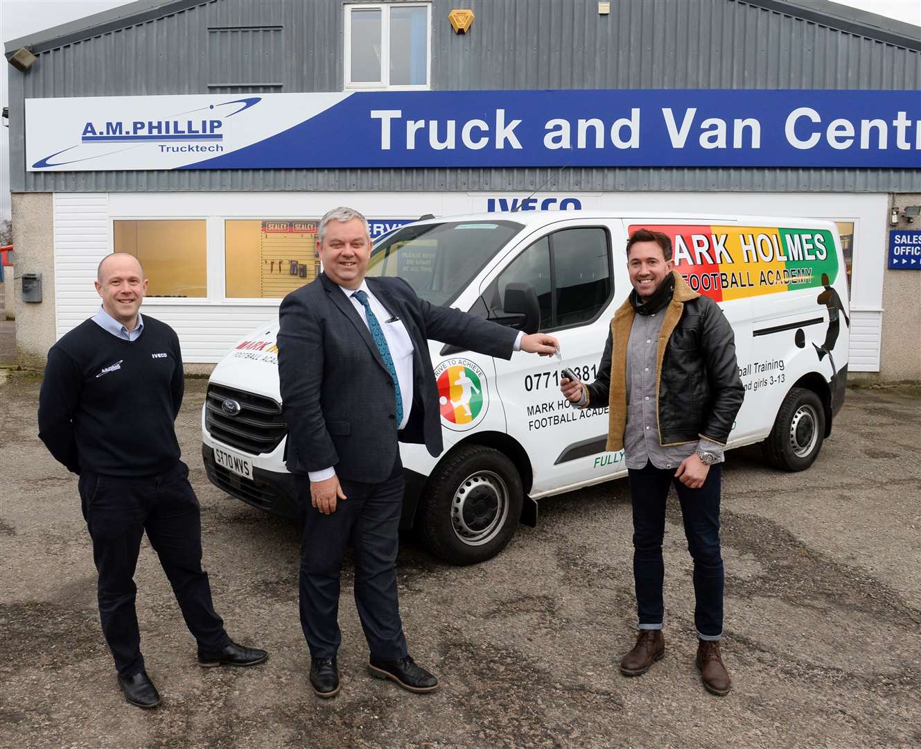 Mark Holmes gets the keys of new van for his Academy from Rob McWilliam,managing director of AM Phillip and David MacRae,comercial vehicle sales..Picture: Gary Anthony..