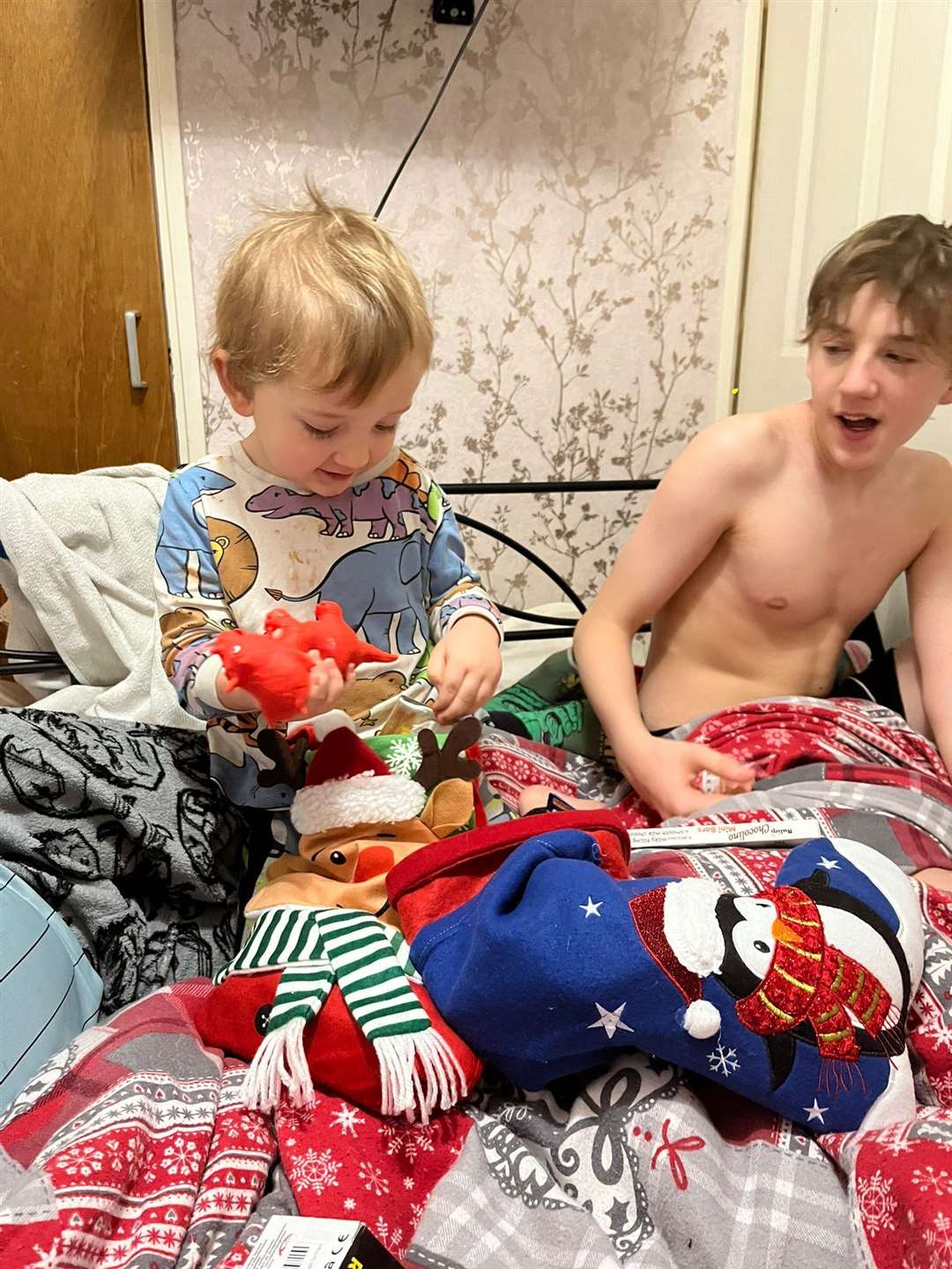 Daisy and Eoin's two other sons opening gifts from Santa on Christmas Day.
