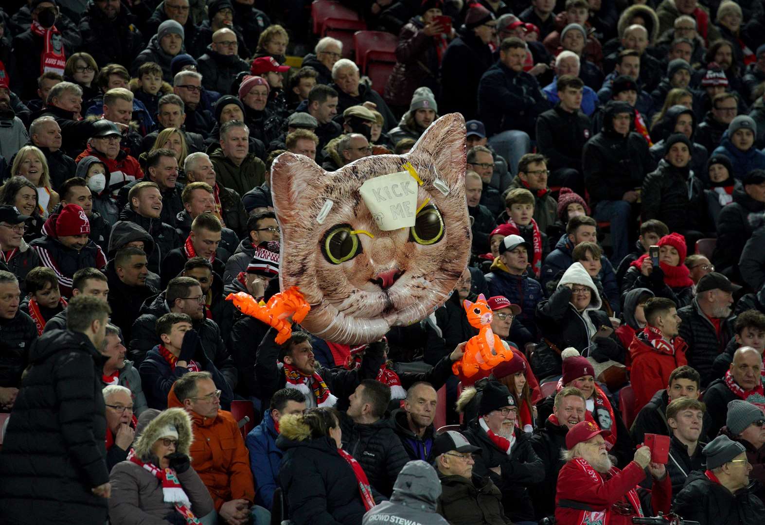Liverpool fans in the stands with an inflatable cat head, aimed at West Ham United’s Kurt Zouma, during the Premier League match at Anfield (Peter Byrne/PA)