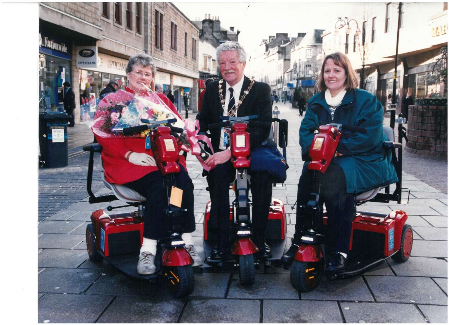 Shopmobility Highland's 1000th member Cathy MacLeod (left), with then-Provost Alan Sellars and Gale Falconer in 1996.