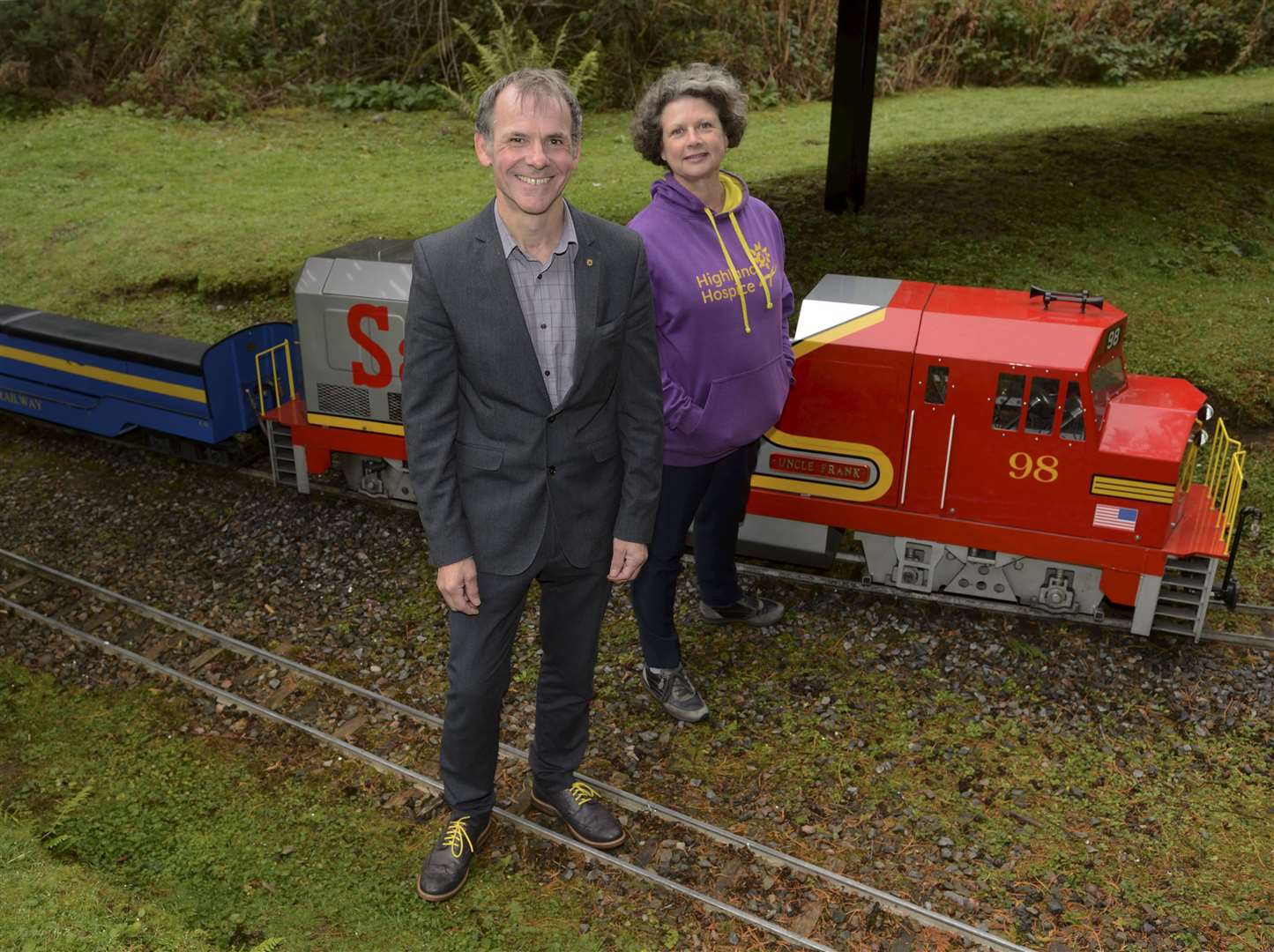 Highland Hospice fundraisers Andrew Leaver and Katie Gibb by the miniature railway track in Whin Park, Inverness.