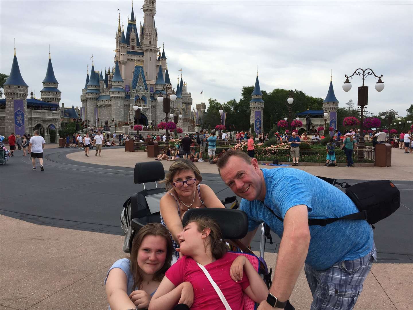 Zoë Jane Sutton, her mother Heather, father Gerry and sister Natasha at Disneyland in Florida.