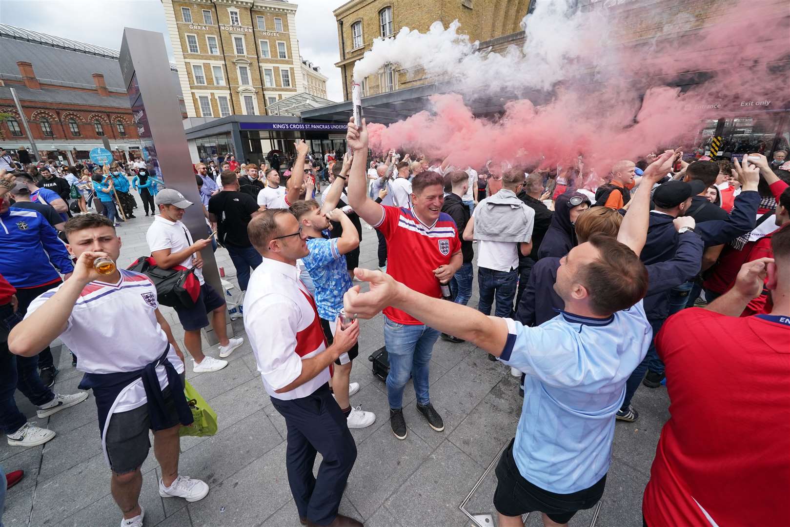 Fans from outside the capital arrive at King’s Cross station in London (Jonathan Brady/PA)