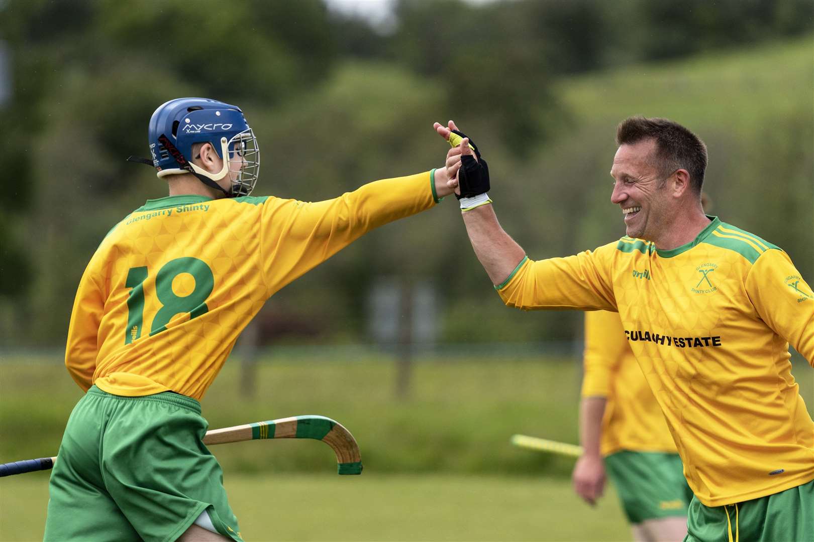 Scott Bremner (right) congratulates Jack West on scoring for Glengarry in the semi final against Boleskine. Picture: Neil Paterson