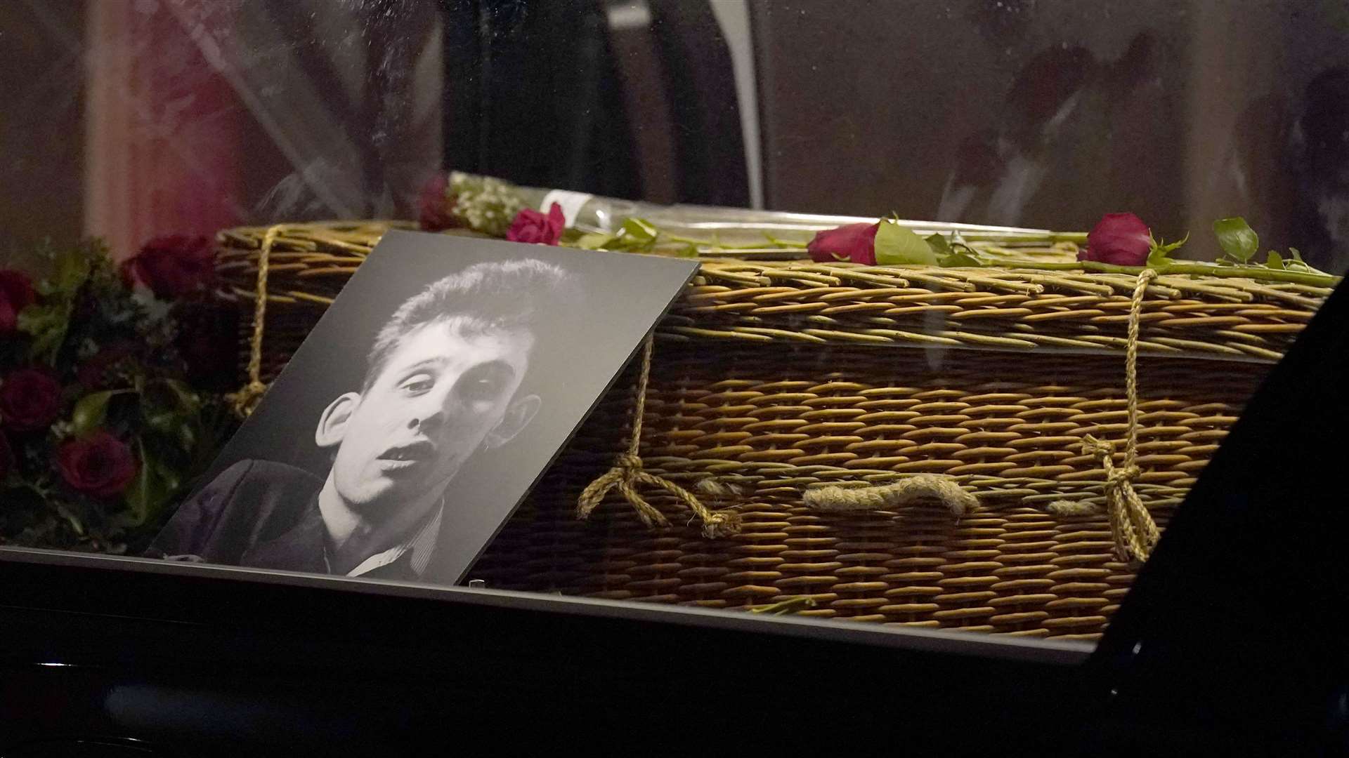 The coffin of Shane MacGowan passes Philip Ryan’s Pub following his funeral at Saint Mary’s of the Rosary Church, Nenagh, Co Tipperary (Niall Carson/PA Wire)