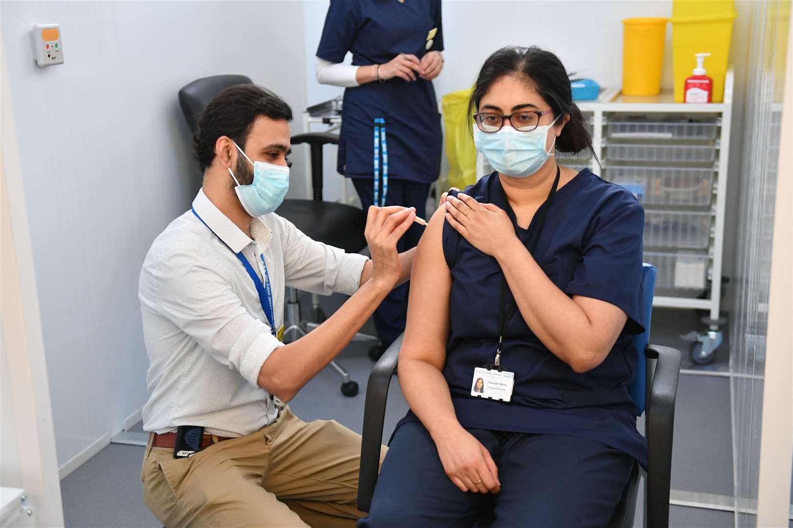 Principal pharmacist Davinder Manku (right) receives an injection of the Oxford/AstraZeneca coronavirus vaccine at The Black Country Living Museum in Dudley (Jacob King/PA)