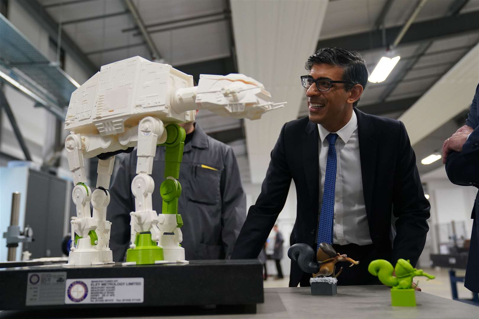 Mr Sunak inspects a 3-D printed model of an All Terrain Armoured Transport walker from Star Wars, earlier this year (Jacob King/PA)