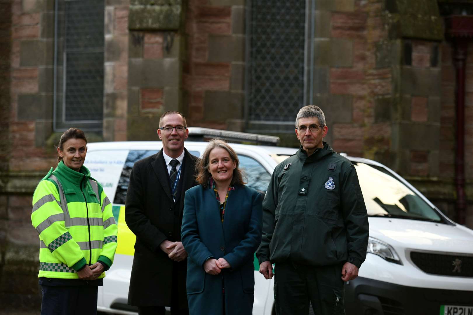 Lesley Smith, team lead, mental health assessment unit with Scottish Ambulance Service chief executive Michael Dickson, MSP Maree Todd and mental health paramedic team leader Trevor Bechtel. Picture: Callum Mackay